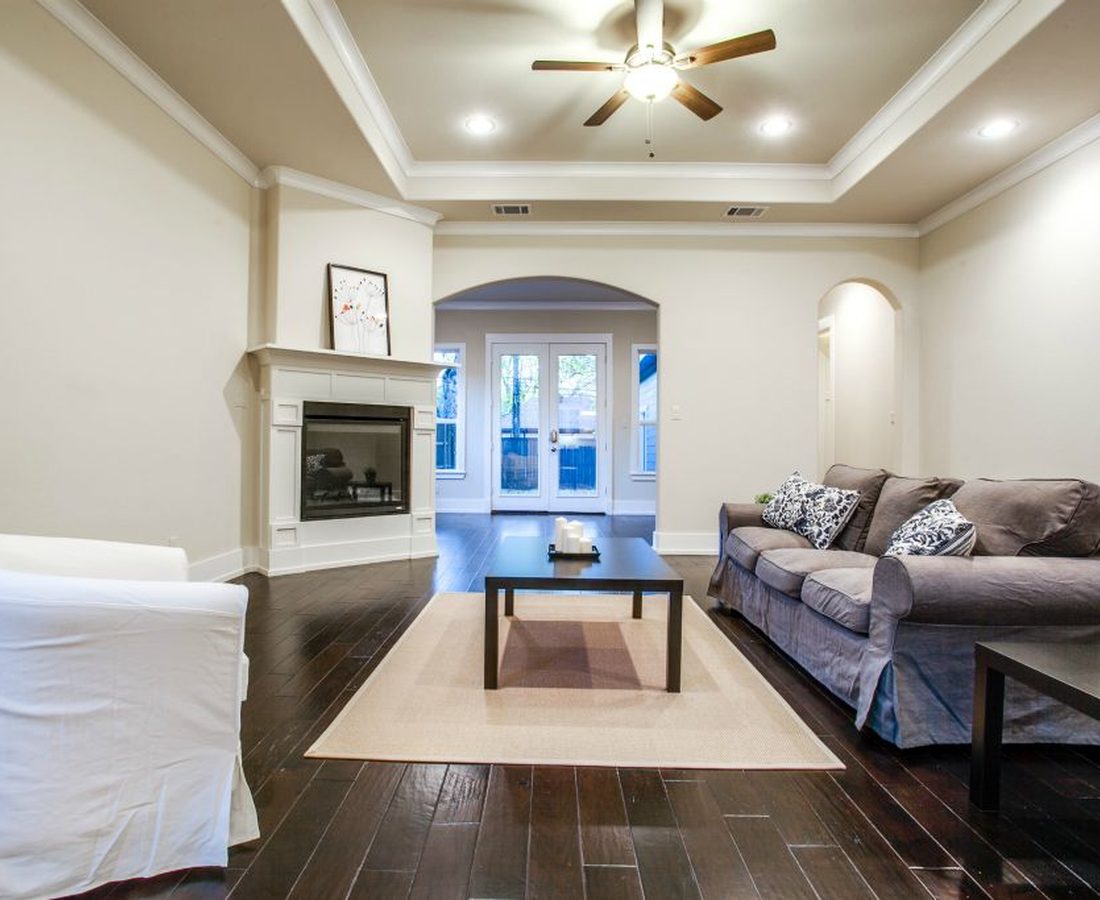 A living room with a rebuilt fireplace after remodeling