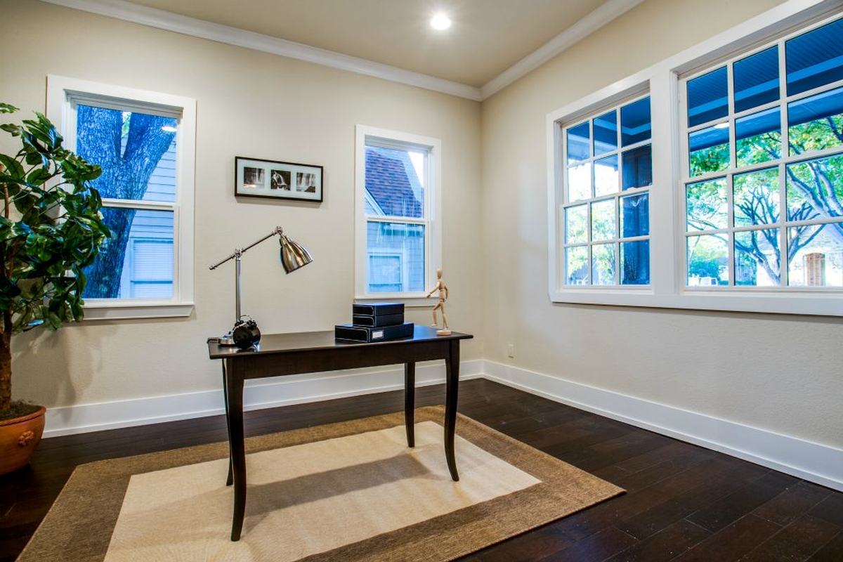 A study, with the desk under the windows.